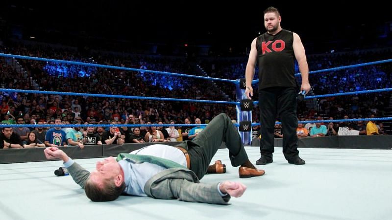 Vince McMahon on the floor after being attacked by Kevin Owens