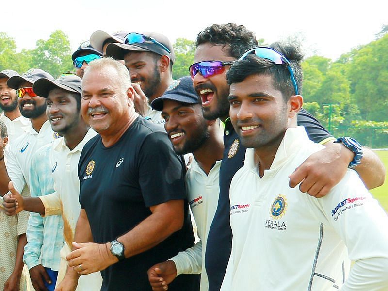 Whatmore celebrates with the Kerala players after winning a match earlier this season