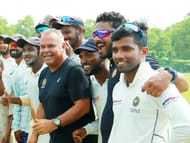 Whatmore celebrates with the Kerala players after winning a match earlier this season