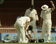 Justin Langer is hit by the ball