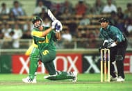 Sth Africa's Hansie Cronje sweeps the ball during