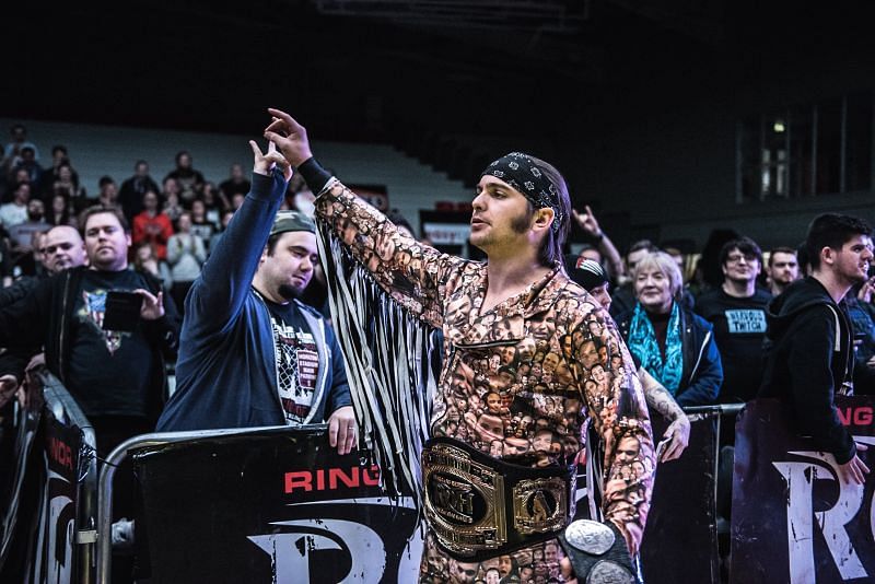 Nick Jackson sharing a Too Sweet with a fan in Ring of Honor