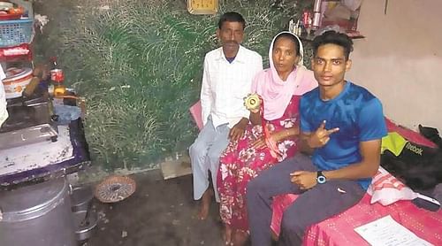 Nisar Ahmed with his parents