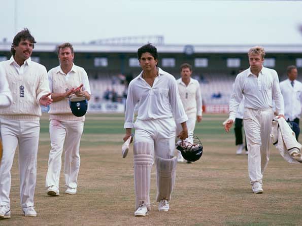 17 year old Sachin Tendulkar walks off to a standing ovation after rescuing his team at Old Trafford. 
