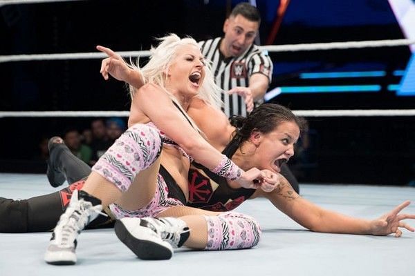 Candice LeRae applies a submission hold on Shayna Baszler