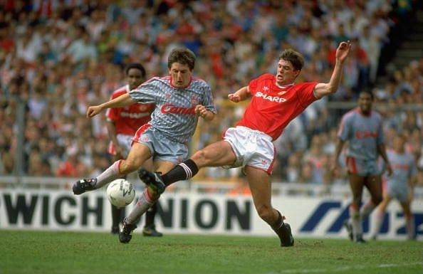 Peter Beardsley of Liverpool and Gary Pallister of Manchester United