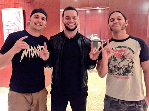 Finn Balor with Matt & Nick Jackson