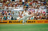 David Boon attempts a spectacular catch as Ian Healy looks on.