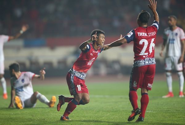 Jerry and Raju celebrate the goal