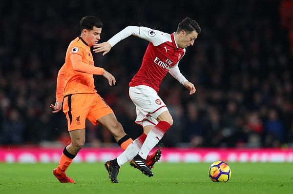 Philippe Coutinho of Liverpool and Mesut Ozil of Arsenal during the Premier League match between Arsenal and Liverpool at Emirates Stadium on December 22, 2017 in London, England. (Dec. 21, 2017 - Source: Catherine Ivill/Getty Images Europe)