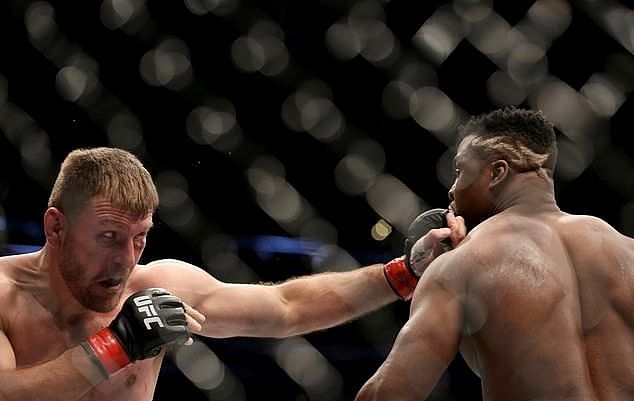 Stipe Miocic (Left) broke the record for consecutive UFC Heavyweight title defenses at UFC 220