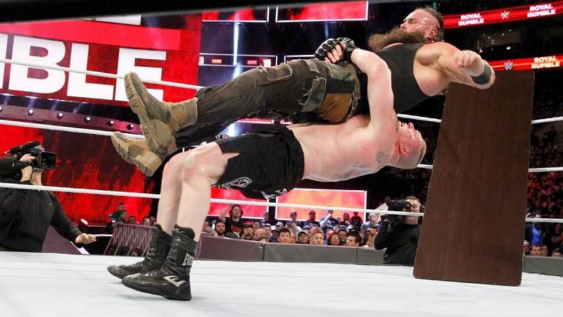 Lesnar hits Strowman with a German Suplex during their match