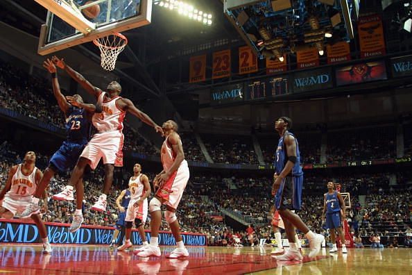 Michael Jordan battles for a rebound against Dion Glover 