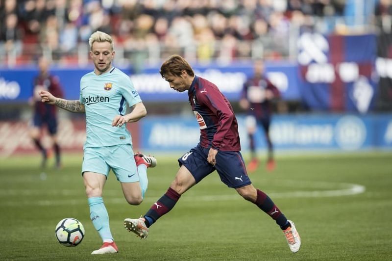 Takashi Inui tries a shot during the game