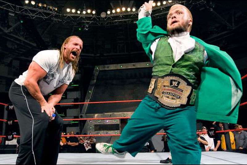 Hornswoggle making HHH laugh in ring
