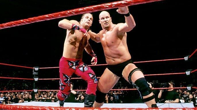 Stone Cold and Shawn Michaels square off in the ring at Wrestlemania XIV