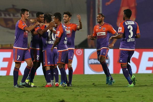 FC Pune City players celebrate a goal