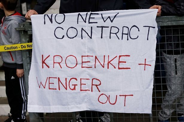 Arsenal fans with banners directed at owner Stan Kroenke and manager Arsene Wenger.