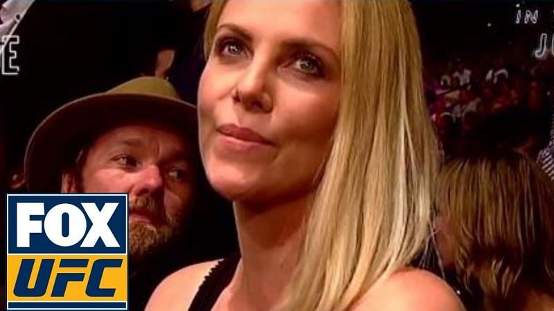 Charlize Theron with Australian actor Joel Edgerton at a UFC event