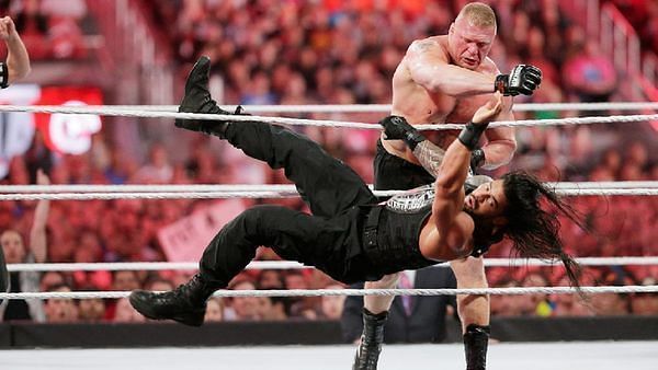 Roman Reigns and Brock Lesner competing against each other at Wrestlemania 31.