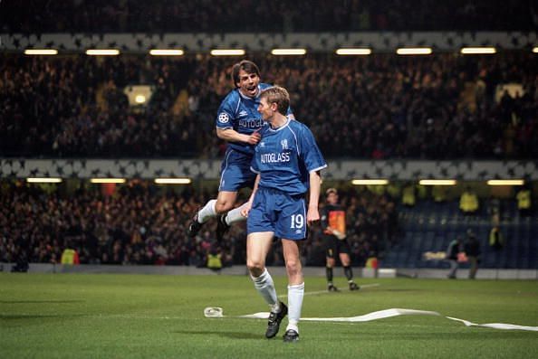Zola and Tore Andre Flo celebrate scoring against Barelona