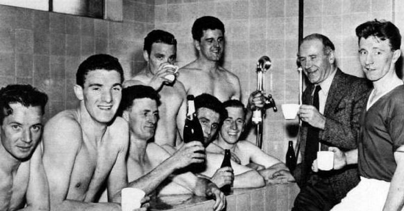 Manchester United celebrating winning the Division One League Championship 1956-1957 for the second year running. Players shown include John Berry, Bill Foulkes, Bill Whelan, Tommy Taylor, Bobby Charlton and captain Roger Byrne