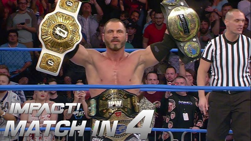 Austin Aries with his Championships