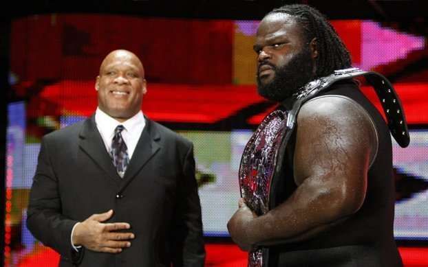 Mark Henry holding the ECW Championship with his manager at the time Tony Atlas by his side