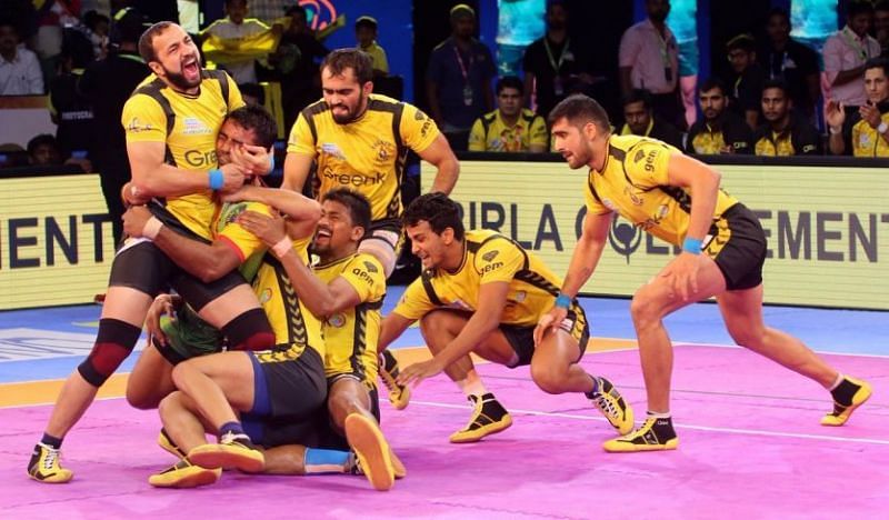 Rakesh Kumar successfully tackles Patna Pirates&#039; Monu Goyat.