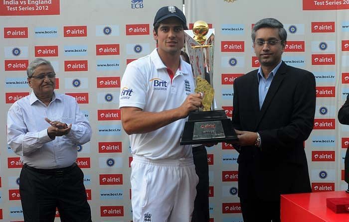 Alastair Cook collecting the winners trophy after defeating India in it&#039;s own backyard