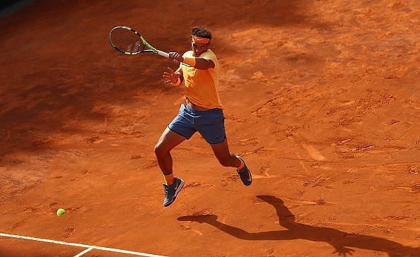 Rafael Nadal hitting a forehand on clay