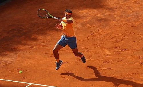 Rafael Nadal hitting a forehand on clay