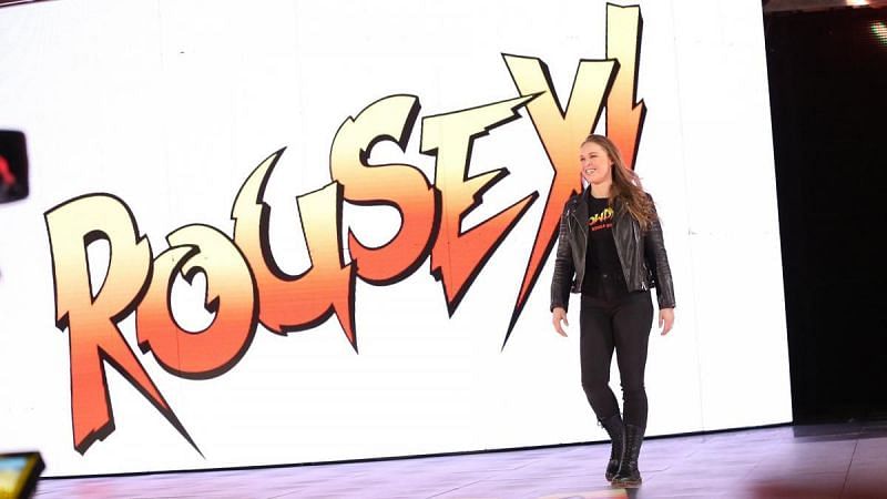 Ronda Rousey will team up with Kurt Angle to face Triple H and Stephanie McMahon