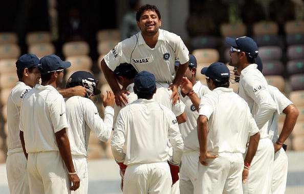 His teammates congratulate Piyush Chawla after taking a wicket in his debut match