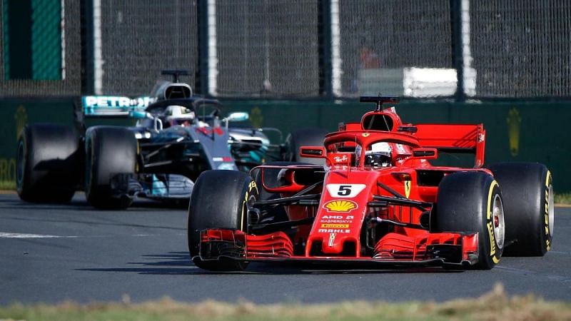 Vettel goes past Hamilton after making a pit-stop
