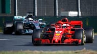 Vettel goes past Hamilton after making a pit-stop