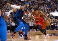 Kyle Lowry drives past Carmelo Anthony