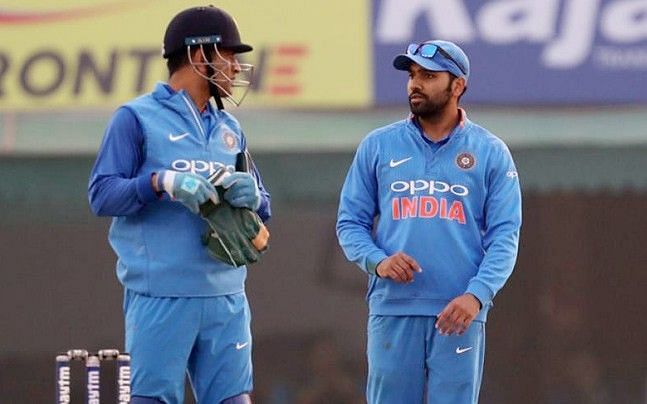 Dhoni and Sharma sharing a moment on the field