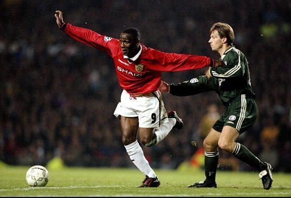 Andy Cole of Manchester United and Bernard Schuiteman of Feyenoord