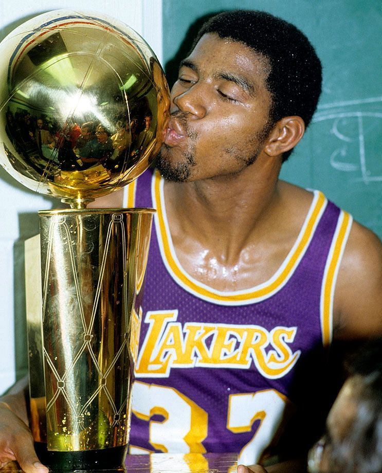 Magic kisses the trophy after one of the most memorable Finals performances.