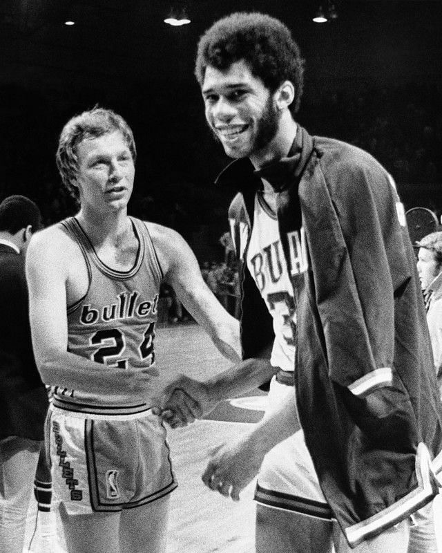 Kareem Abdul-Jabaar shakes the hand of an opponent after defeating him in the Finals.