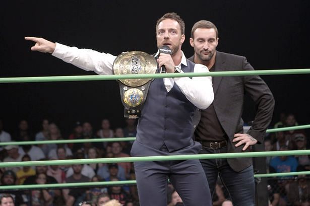 Eli Drake as the GFW World Champion with Chris Adonis (right)