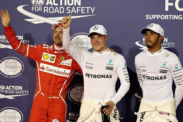 Valtteri Bottas celebrating his pole position at the 2017 Bahrain Grand Prix, alongside Hamilton and Vettel