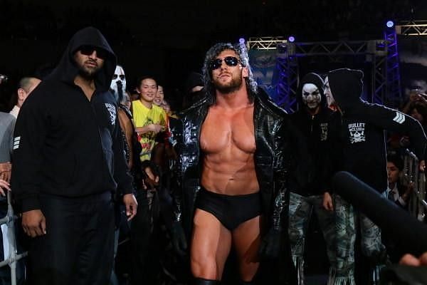Kenny Omega with the Bullet Club 