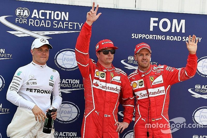 Kimi Raikkonen after taking pole in Monaco 2017 next to Valtteri Bottas &amp; Sebastian Vettel