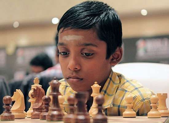 Rameshbabu Praggnanandhaa with Viswanathan Anand. Rameshbabu