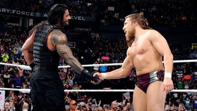 Roman Reigns shaking hands with Daniel Bryan 