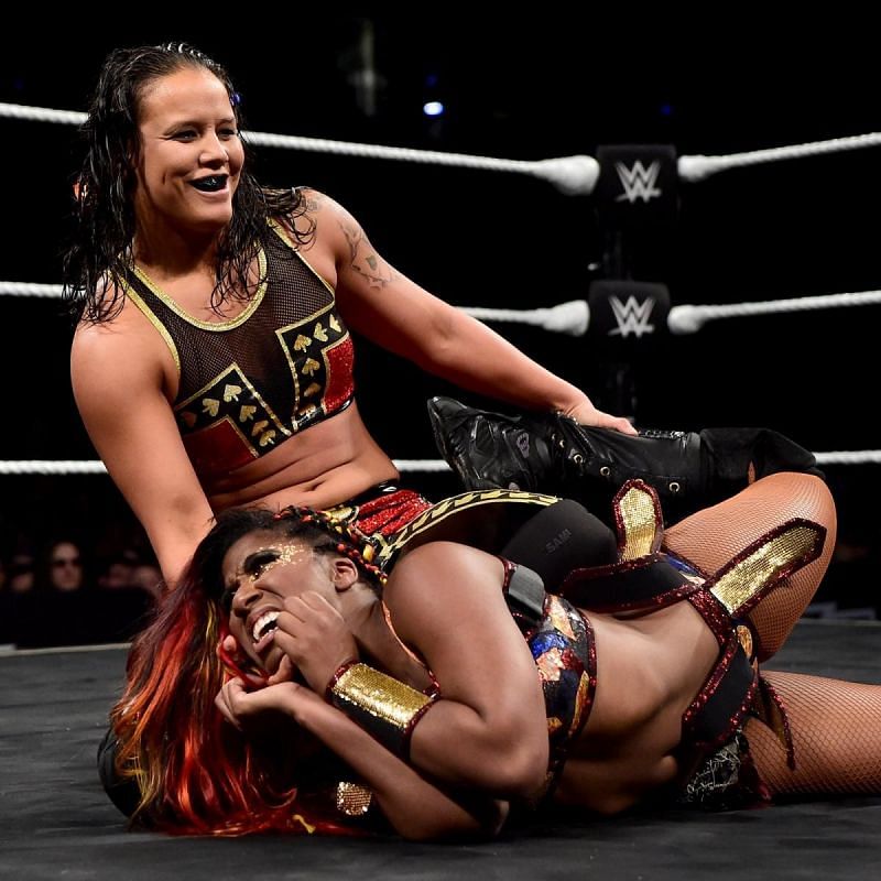Shayna Baszler toying with Ember Moon