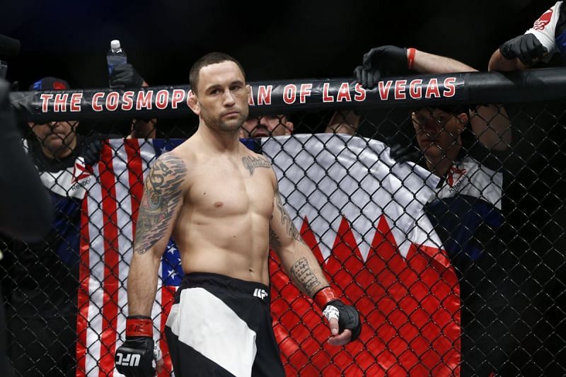 Frankie Edgar standing with the Bahraini &amp; US Flags in the Background