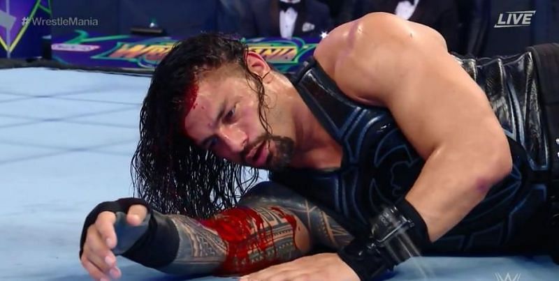 Roman Reigns dons the crimson mask in one of the night&#039;s many shockers.